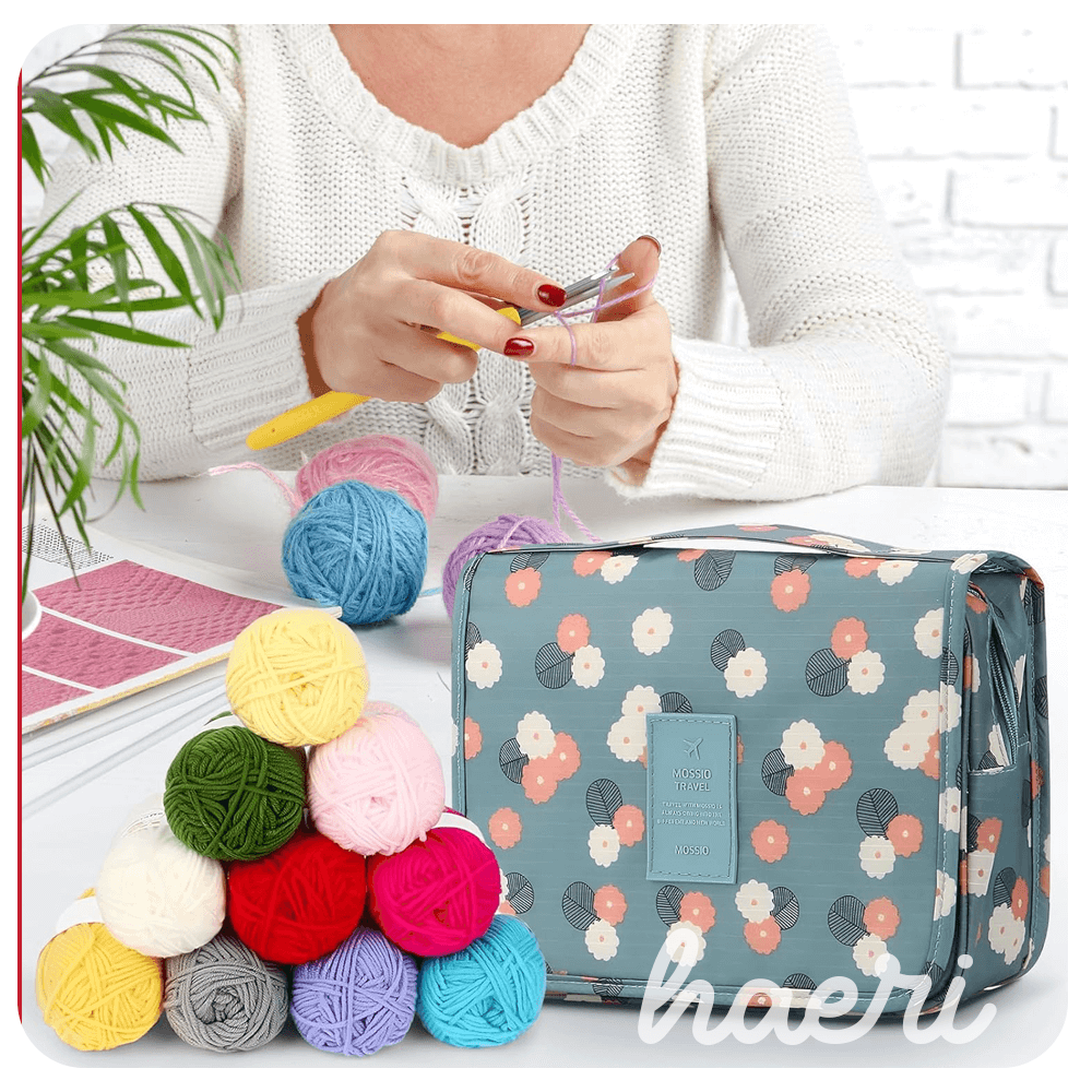 Person crocheting with colorful yarn and a stylish storage bag, perfect for DIY projects and gifts.