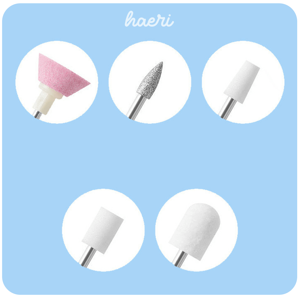 Different nail drill bits for manicures and pedicures, including pink, silver, and white options.