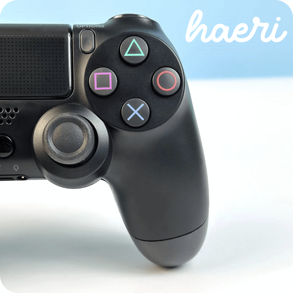 Wireless black PS4 controller compatible with Android, iOS, and PC via Bluetooth, shown with buttons and joystick close-up.
