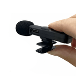 Wireless K8 Lavalier Microphone with Type-C connection, suitable for iPhone 15/16 & Android, black color, held in hand.