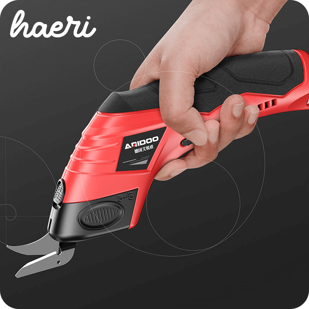 ARIDOO electric fabric shears being held, featuring ergonomic design and sharp blade, ideal for precise cutting.