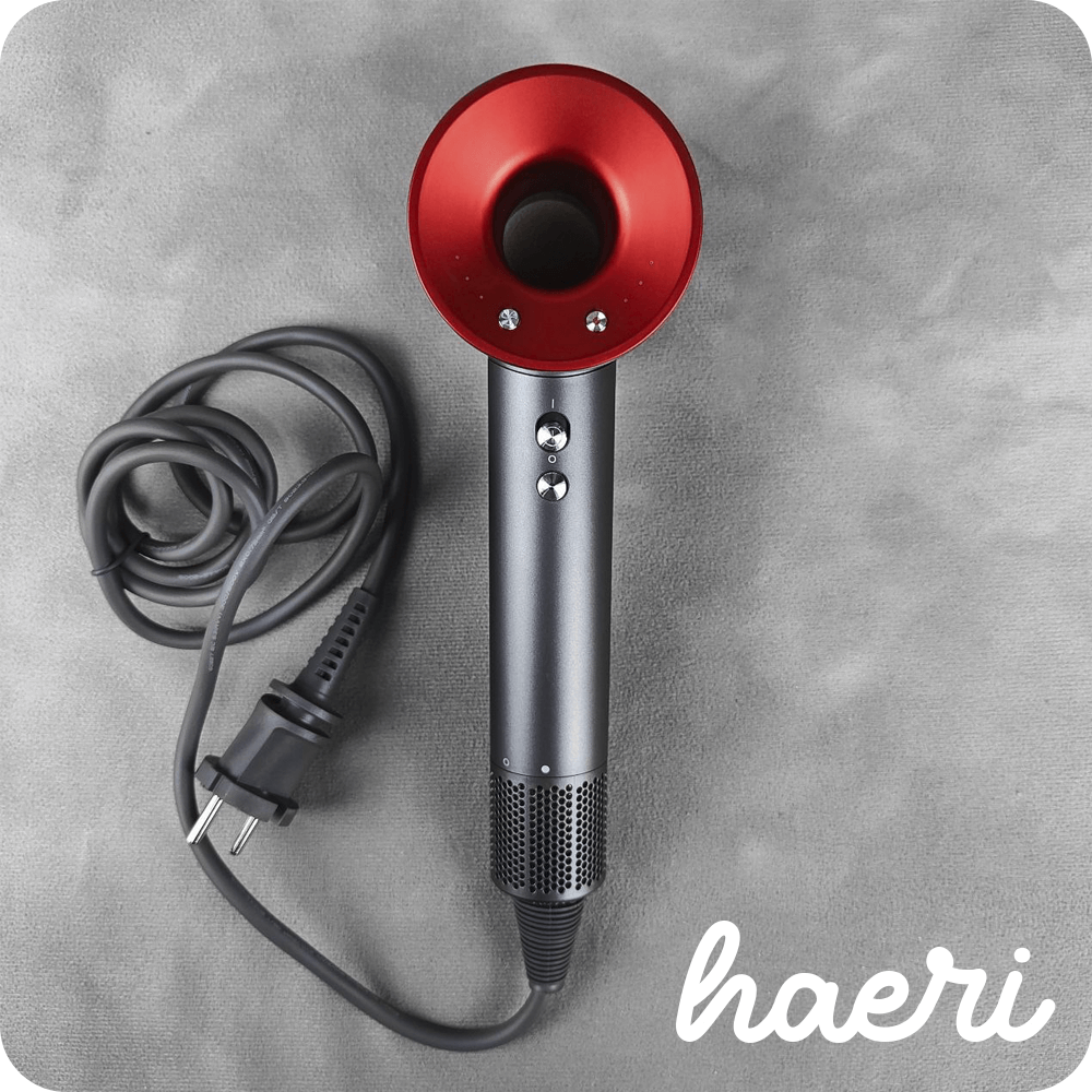 Innovative hair dryer with 3 speeds, 4 temperature modes, ionization function, sleek design, resembling Dyson Supersonic.
