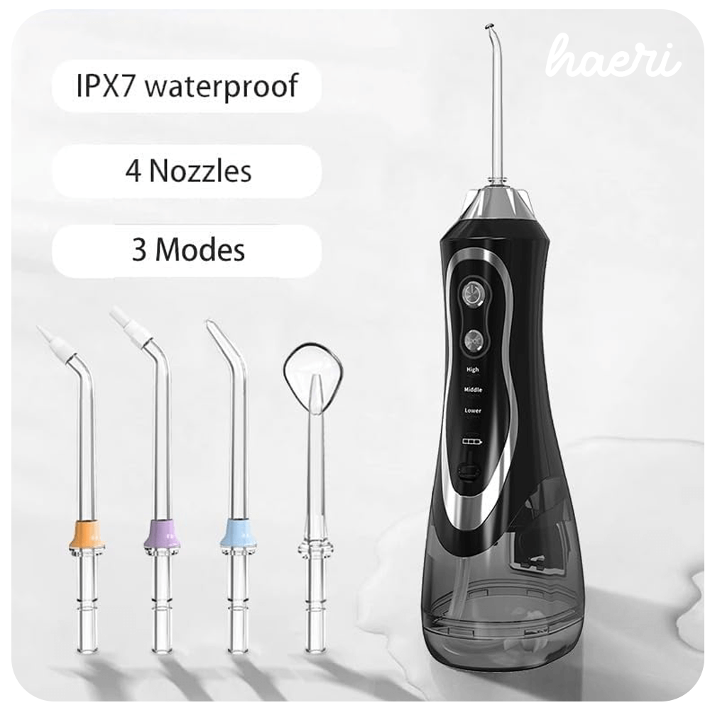 Black oral irrigator with IPX7 waterproof design, featuring four nozzles and three modes for effective dental care.