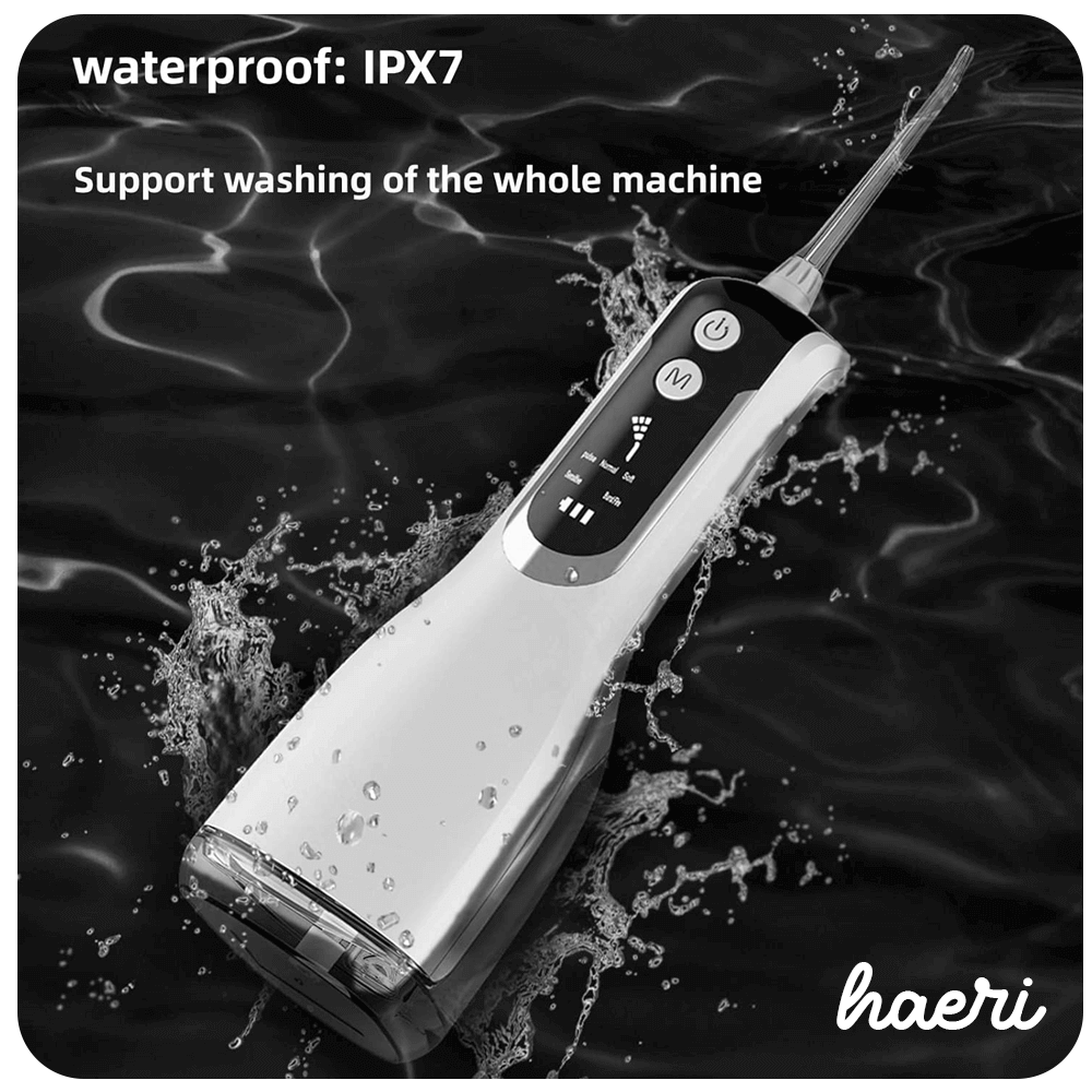 Black L12 oral irrigator with waterproof IPX7 rating, cordless design, floating in water, showing control buttons.