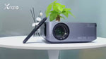 Xnano X1 projector on table, showcasing 8K resolution and sleek design.