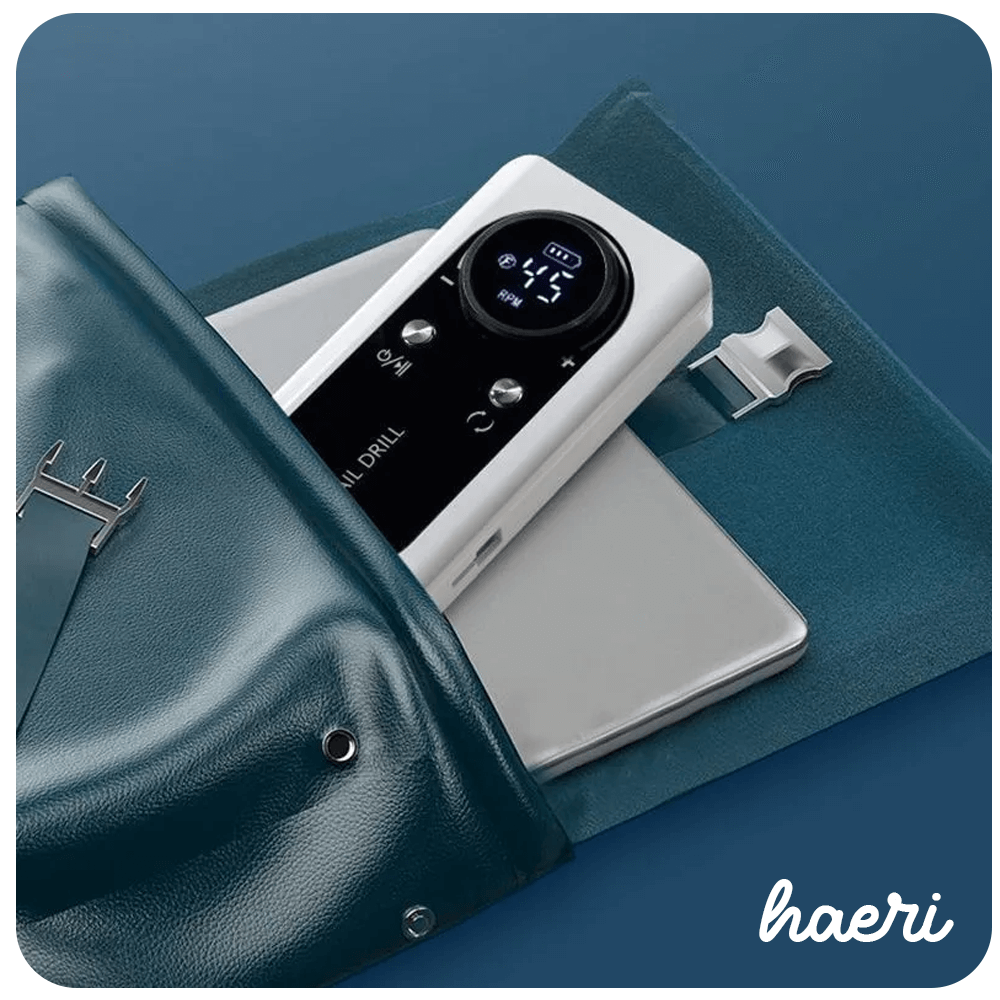 Wireless Nail Drill V2 in white, showing digital display and Type-C charger, peeking out of a stylish blue leather case.