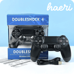 Wireless PS4 controller "Doubleshock 4" with black finish and USB cable, compatible with Android, iOS, and PC.