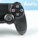 Wireless black PS4 controller compatible with Android, iOS, and PC via Bluetooth, shown with buttons and joystick close-up.